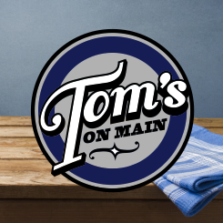 logo design Tom’s on Main